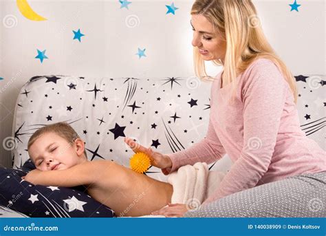 mother and son massage|A mother.